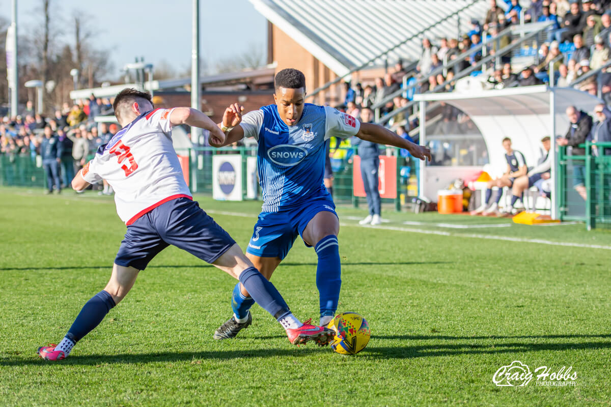 Jordan Ragguette takes on Benjamin Griffith_AFC Totton vs Willand Rovers_SLD1S_26Feb22.jpg