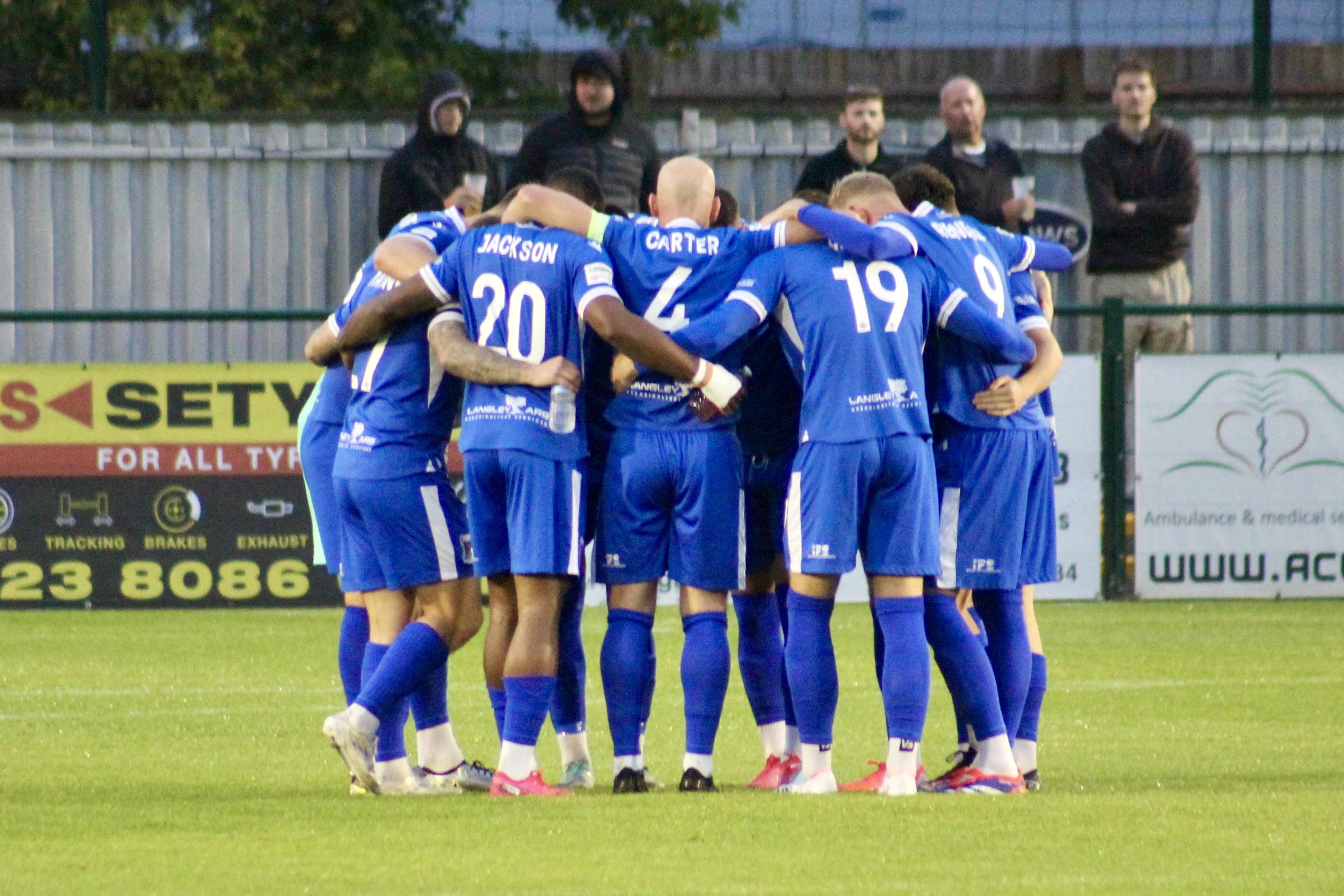 Squad huddle before Chesham (H).jpeg