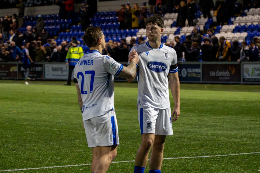 Tans & Ward emotional handshake.jpg