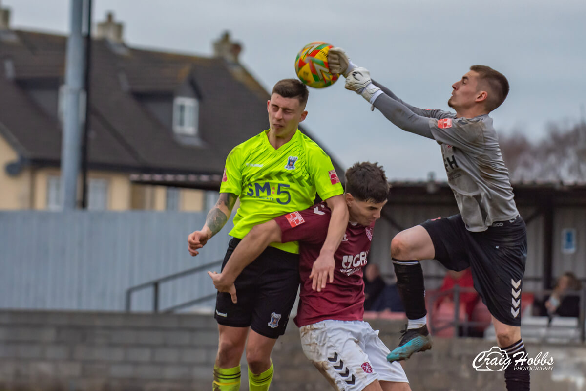 Ethan Taylor_Goalkeeper Aaron Sainsbury_Paulton Rovers vs AFC Totton_SLD1S-22_Sat11Feb2023.jpg