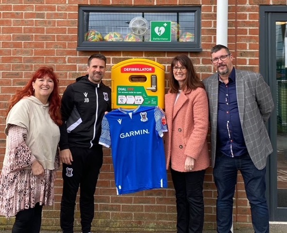 IPS donate a defibrillator.jpeg